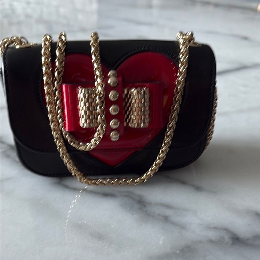Chic Black and Red Crossbody Bag with Gold Chain